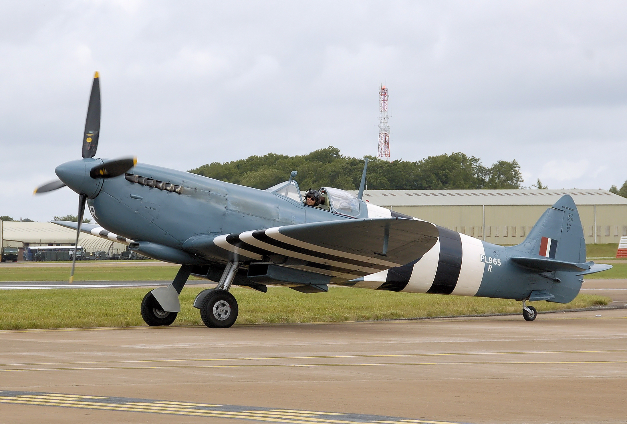 Photographic reconnaissance Spitfire PR Mk XI wearing 1944 invasion stripes. wikimedia