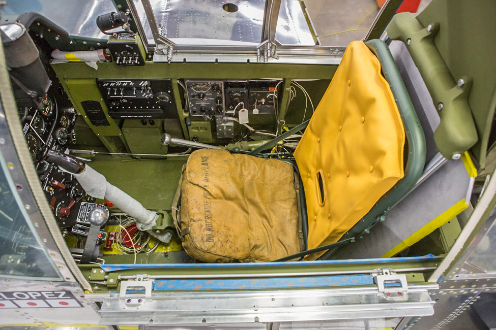 In this view of the seat and stick from above, you can see that there is still some wiring being done. (photo via AirCorps Aviation)