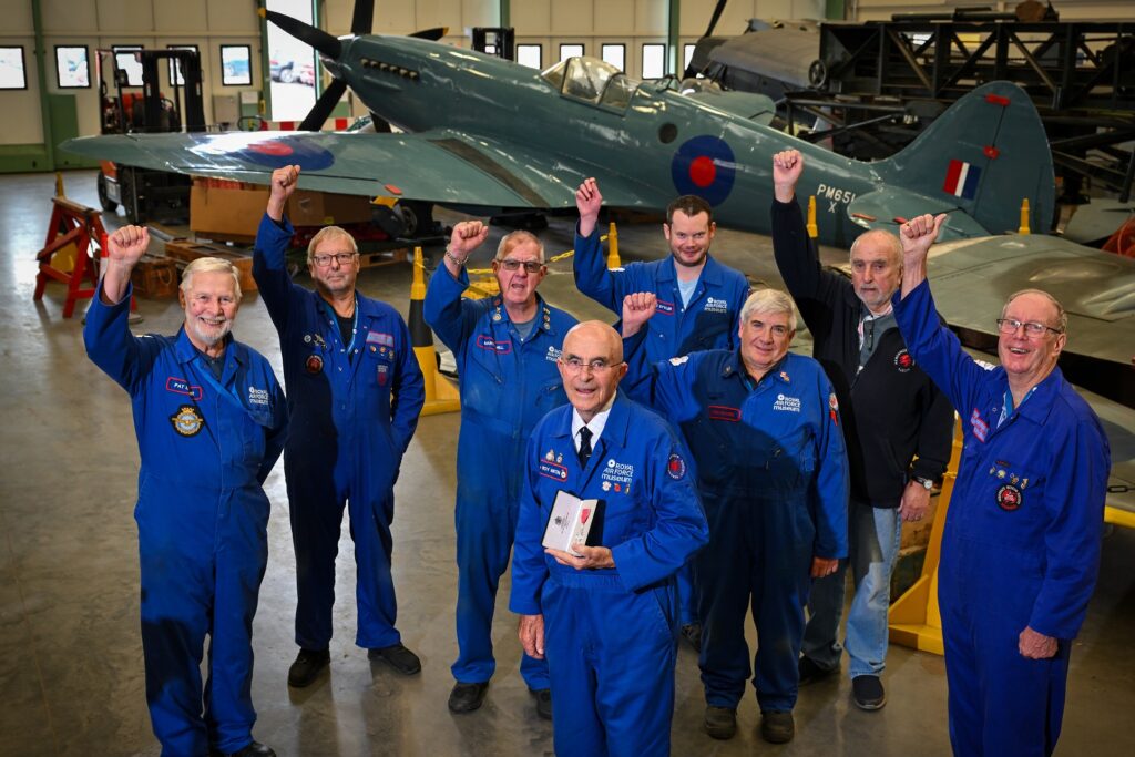 RAF Museum Volunteer Roy Martin celebrates MBE with his fellow engineering Volunteers