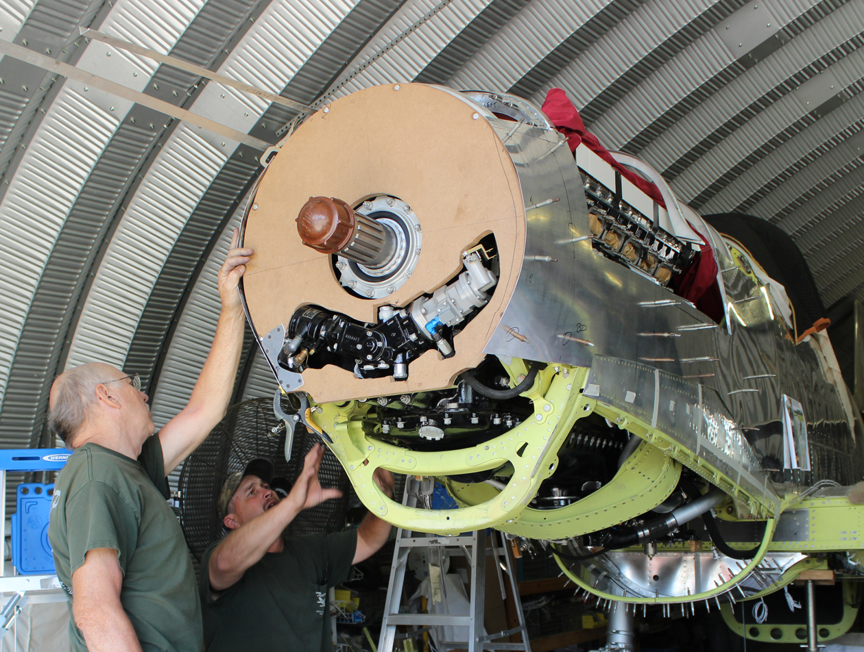 Paul and Randall fitting the side cowls to the temporary wooden form. (photo via Tom Reilly)