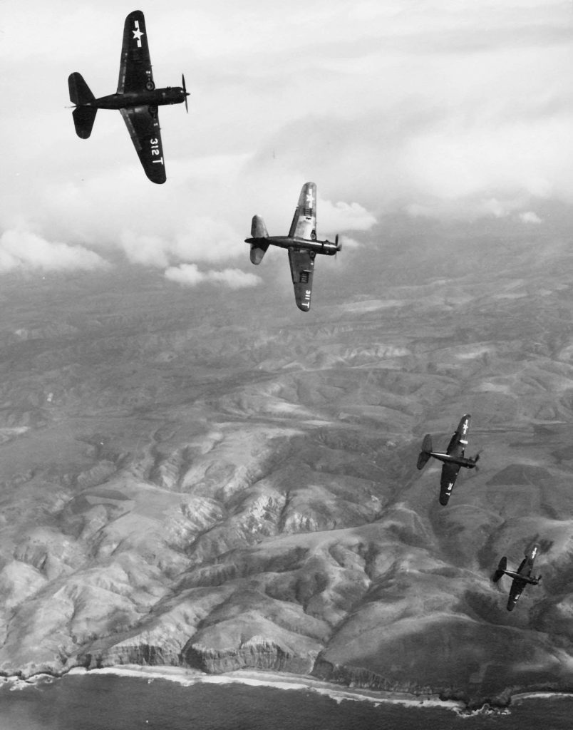 SB2C 5 Helldivers roll into dives during exercise in 1947