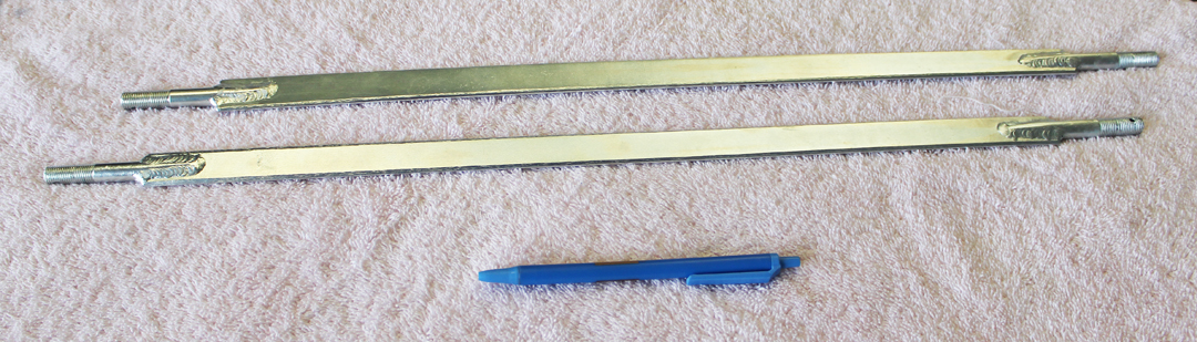 The airfoil support rods for mounting the forward part of each belly scoop (shown with a pen for scale). (photo via Tom Reilly)
