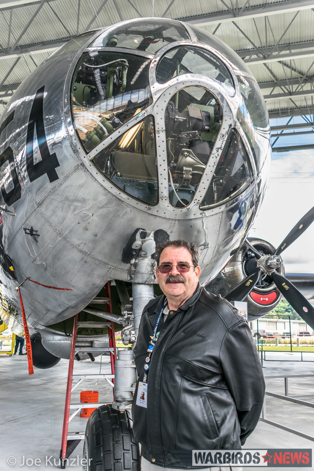 Scott Taylor and the B-29 he helped to restore. (photo by Joe Kunzler)