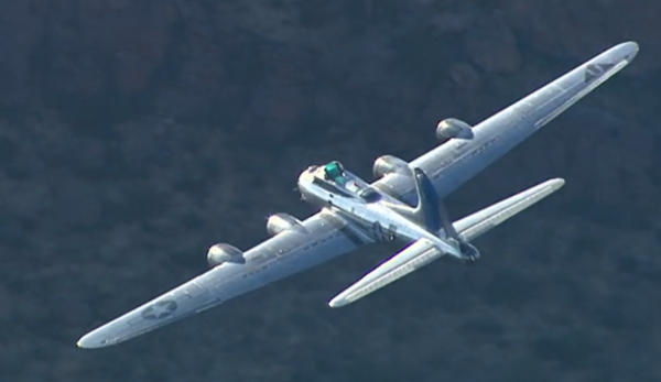 Boeing B-17 Sentimental Journey flying low over Arizona's Superstition Mountains .