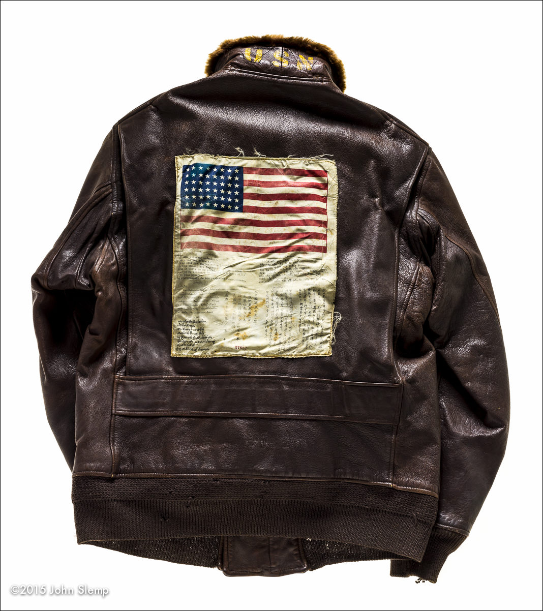  The "blood chit" on the back of the jacket was a billboard, written in many of the SE Asian languages, basically advising locals that the wearer was an American serviceman. If aided with food and shelter, and safely returned to allied lines, there would be a reward for their efforts.  Notice the "USN" on the collar.  This G-1 belongs to the National Naval Aviation Museum collection in Pensacola, Florida. 