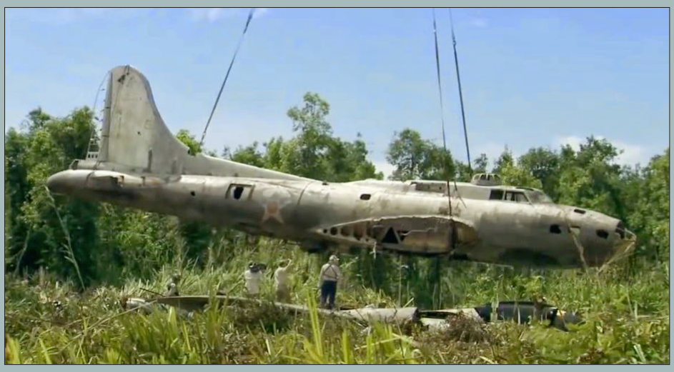 The Swamp Ghost and the Fight to Protect Pacific War Wrecks 18 Swamp Ghosts fuselage being lifted by helicopter
