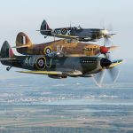 Swinging round to the west to complete the 360 degree turn. Photo Peter Handley Vintage Wings of Canada