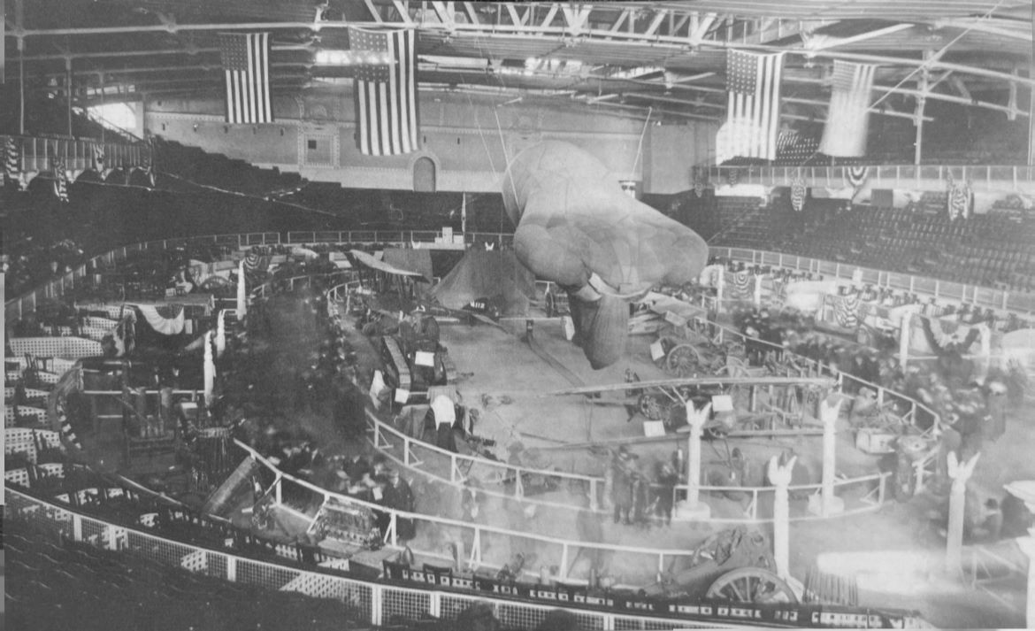 The Allied War Exposition AWE displays at the Kansas City Convention Hall in December 1918. Stropp is placed below the tail of the Caquot observation balloon Norwich University Archives