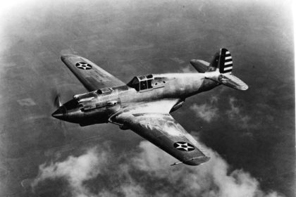 The Curtiss Wright XP 40 prototype 38 10 on its first flight 14 October 1938. Test pilot Ed Elliot is in the cockpit. San Diego Air and Space Museum Archives