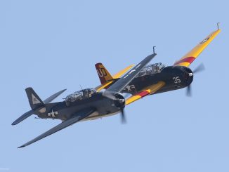 The Planes of Fame s TBM Avenger eft and Sanders Aeronautics TBM Avenger right come together in a formation pass