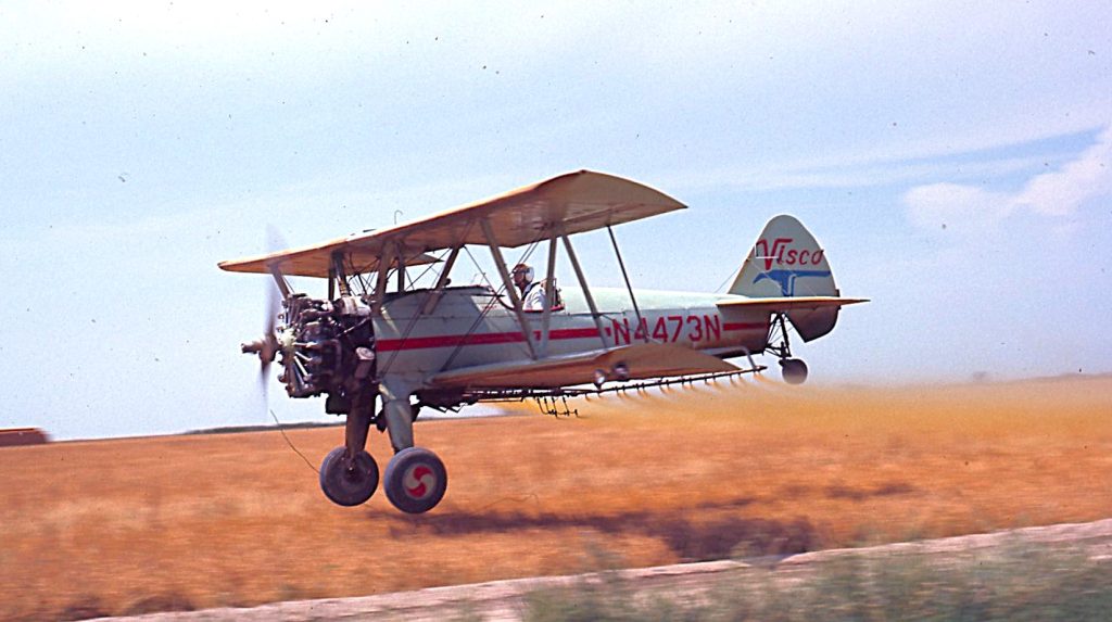 From Downwind Dreams to Duster Tribute: Mike Hoffrage’s Stearman Story 13 This 1971 photo by James Walker shows a modified Stearman bi plane spraying very close to the ground. The plane was operated by Visco of Imperial
