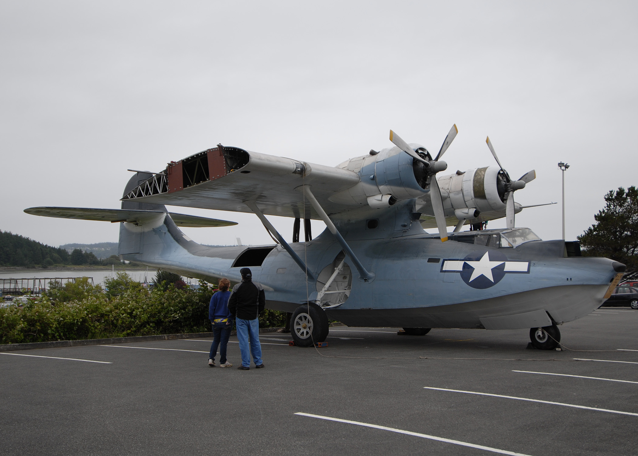 US Navy 100625 N 9520G 004 A father and daughter look at a World War II era PBY 5A seaplane at Simard Hall at the Naval Air Station Whidbey Island Seapl