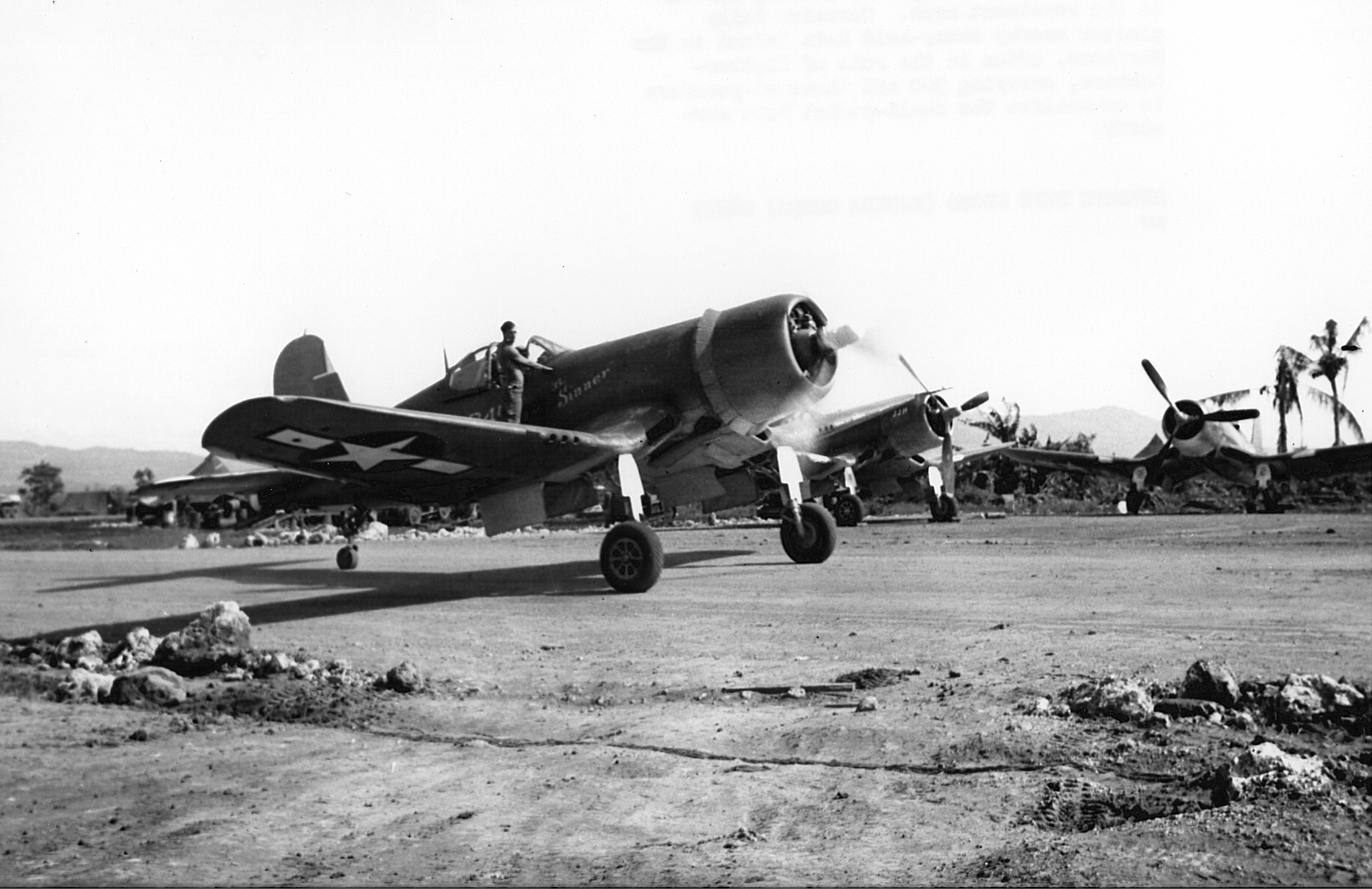 Vought F4U 1A Corsair VMF 225 MAG 21 Guam the Sinner mechanic on the wing guiding the pilot 12th Oct 1944 01