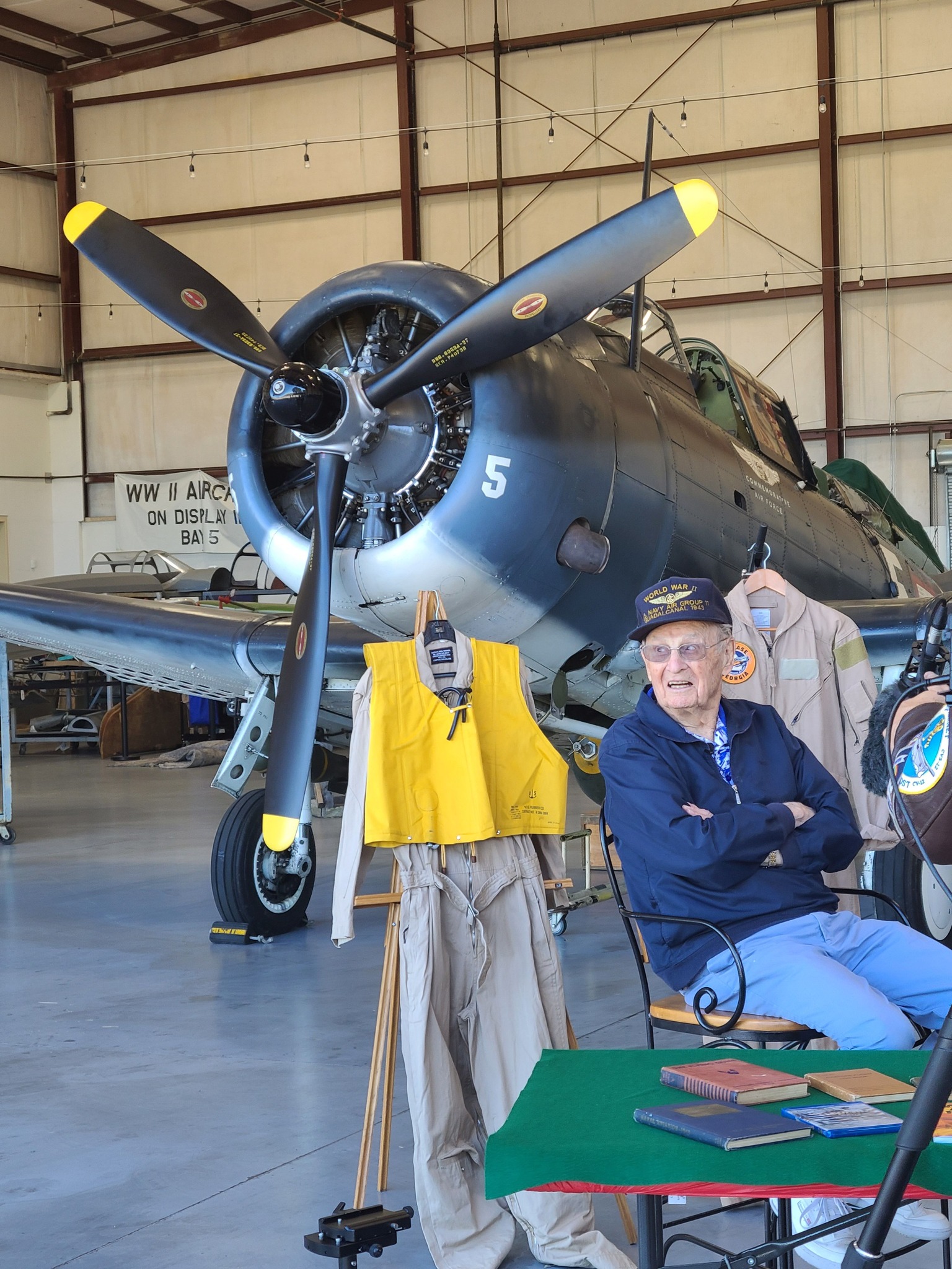 WWII veteran gunner Dick Miralles relives his wartime flying in a restored SBD Dauntless dive bomber 80 years after he fought in the war. photo courtesy of Angela Decker