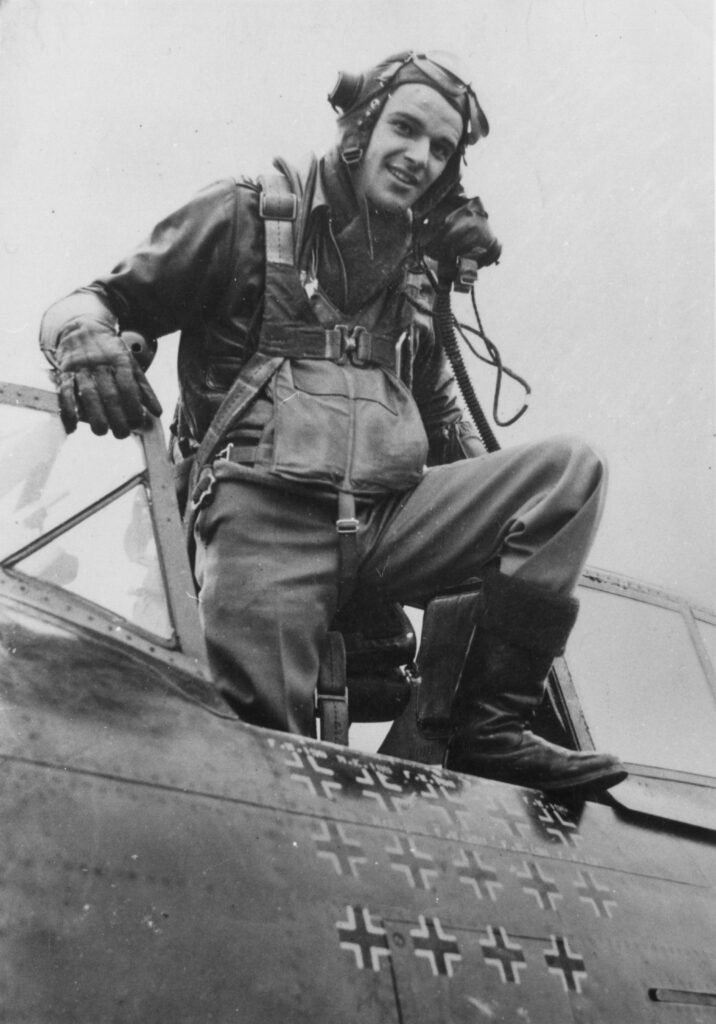 Walker Mahurin emerges from the cockpit of his P 47 American Air Museum in Britain