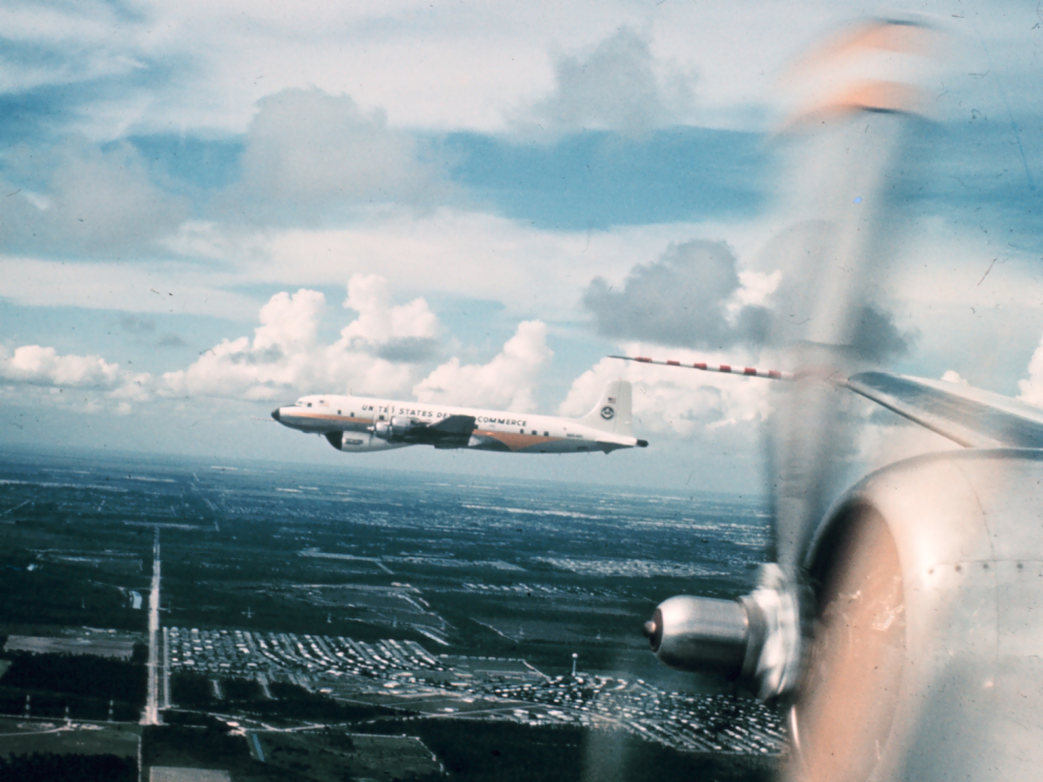 Weather Bureau DC 6 N6540C in flight as seen from DC 6 N6539C.Painted with ESSA designator