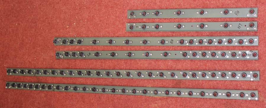 Freshly remanufactured XP-82 wing attach angle nut plate channels. Note the uneven nut plate spacing. (photo via Tom Reilly)