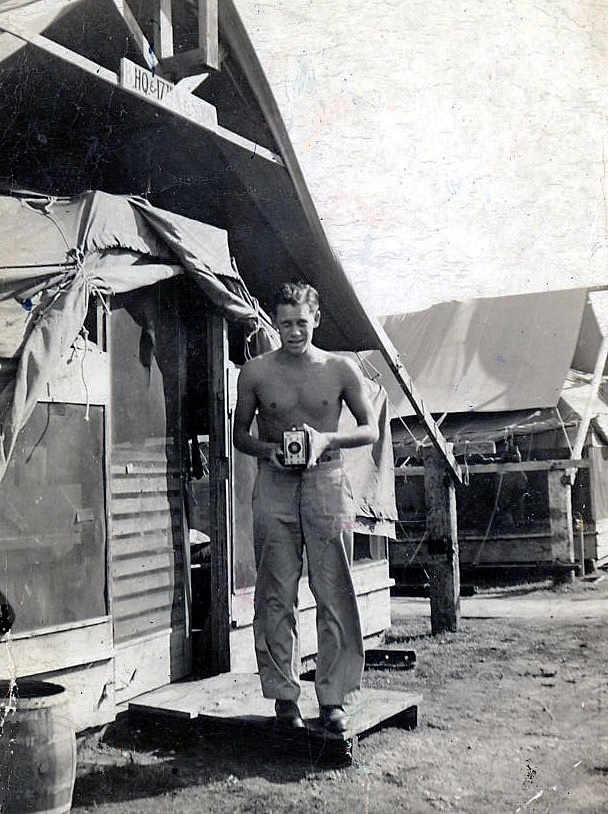 The author's dad, Herb Gilmore, in front of a tent in "Tent City" at Hickam Field. (Photo via Author)
