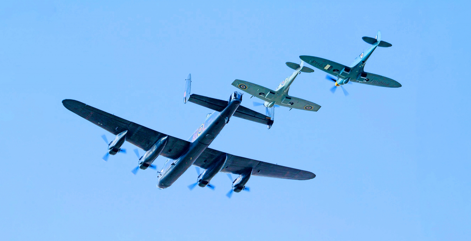 he Lancaster and two Spitfires performed a second three ship display. Photo Phil Cooke