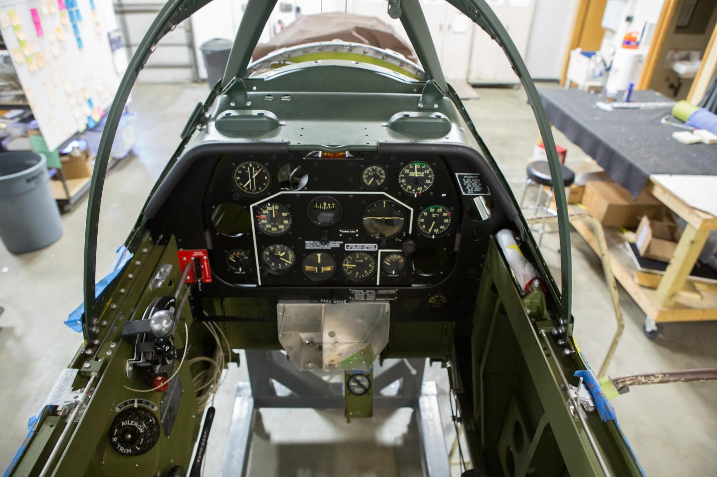 The cockpit coming together last summer. (photo via AirCorps Aviation)
