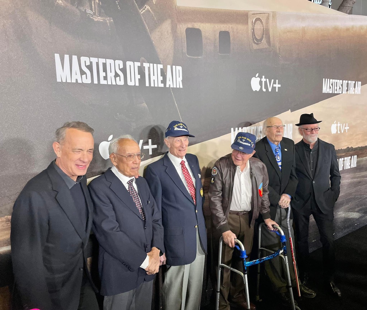 Tom Hanks with WWII veterans of the 100th Bomb Group. [Photo by Nicholas Kanakis]