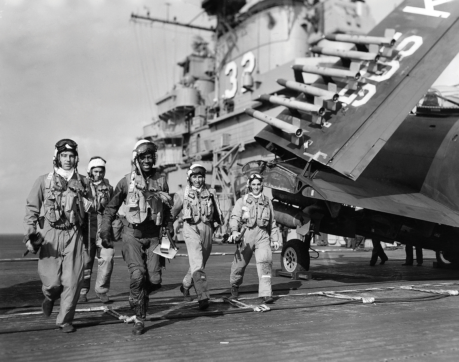 Ensign Jesse L. Brown, the first African-American naval aviator, walking with his cremates aboard the USS Leyte during the Korean War. (photo via Bryan Makos)