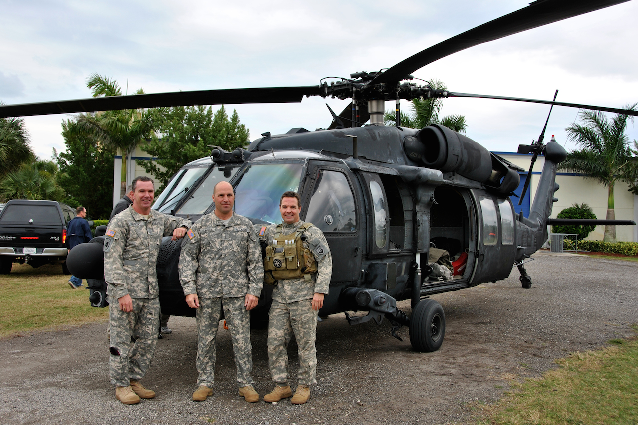 Pilots from the 160th Special Operations Aviation Regiment (Airborne) stand with the unit’s last MH-60K Black Hawk, tail number 388, prior to handing the aircraft over to the National Navy Sea, Air and Land (SEAL) Museum Wednesday. The aircraft will be put on display to help museum visitors further understand the unique relationship between Army Special Operations Aviators and the Navy SEALs. (U.S. Army photo by Sgt. 1st Class Thaddius S. Dawkins II, United States Army Special Operations Aviation Command (Airborne) Public Affairs)
