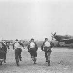 pc94 152 60 Pilots of 303 Squadron walking away from a Hurricane. Photo RAF Museum Collection