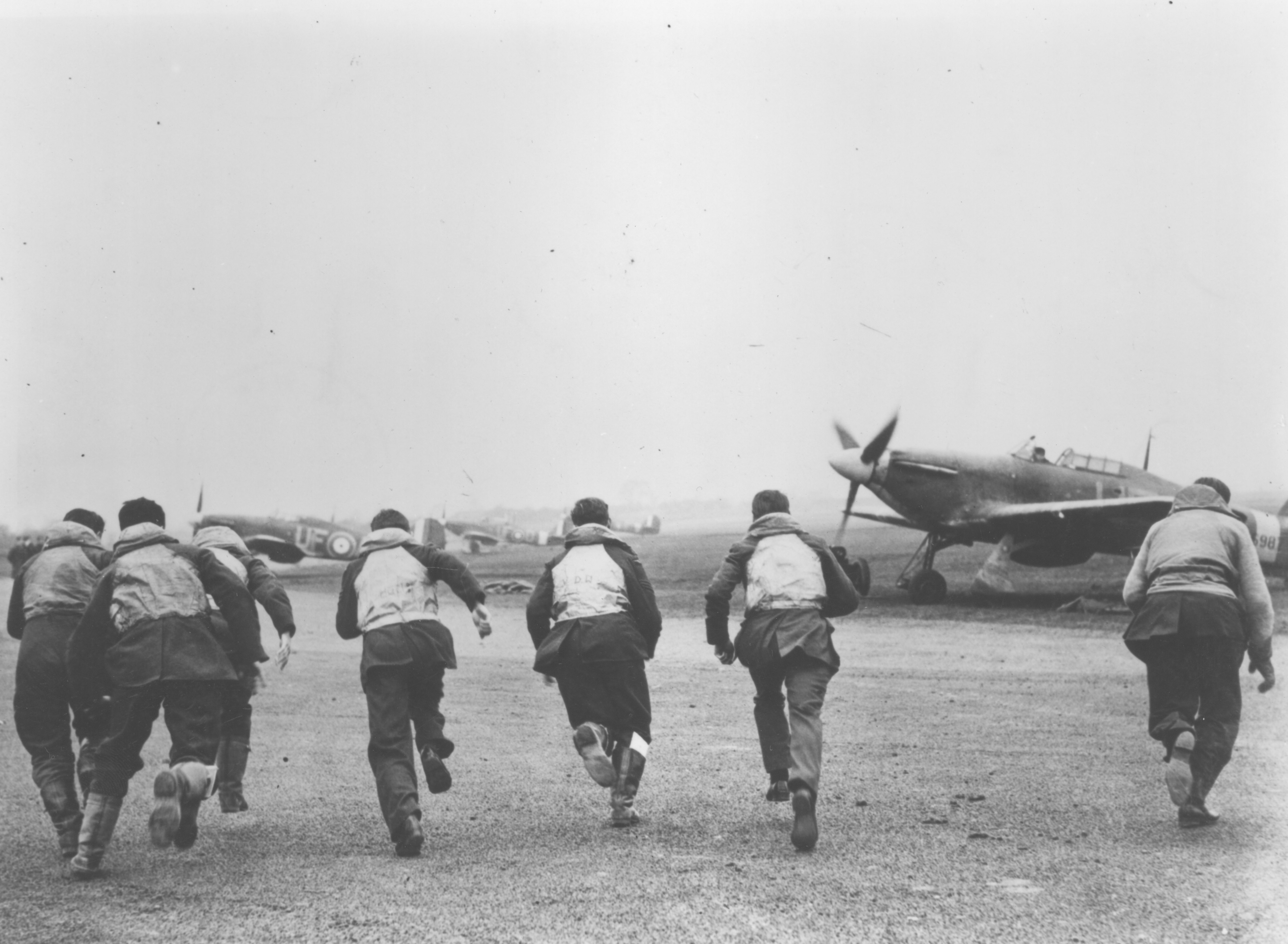 pc94 152 60 Pilots of 303 Squadron walking away from a Hurricane. Photo RAF Museum Collection