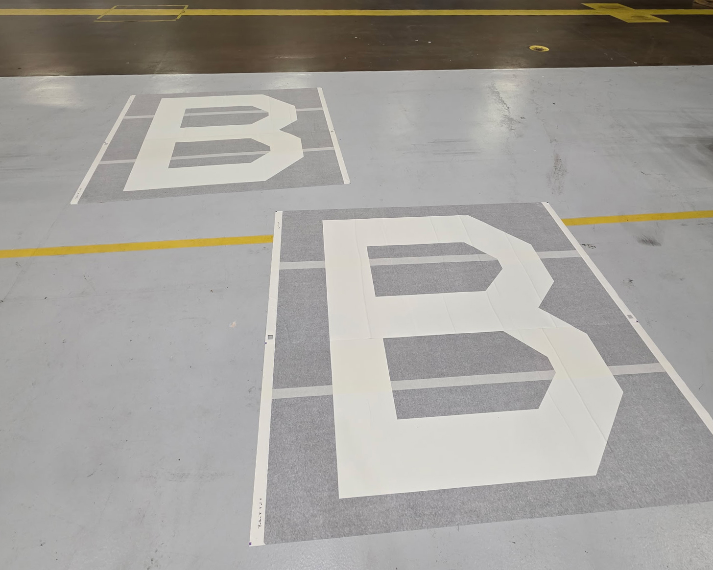 95th Wing Revives Historic WWII 'Square B' Tail Marking on E-4B Nightwatch 14 two square b vinyl appliques lay on the ground prior to installation on an e 4b nightwatch at offutt air force base